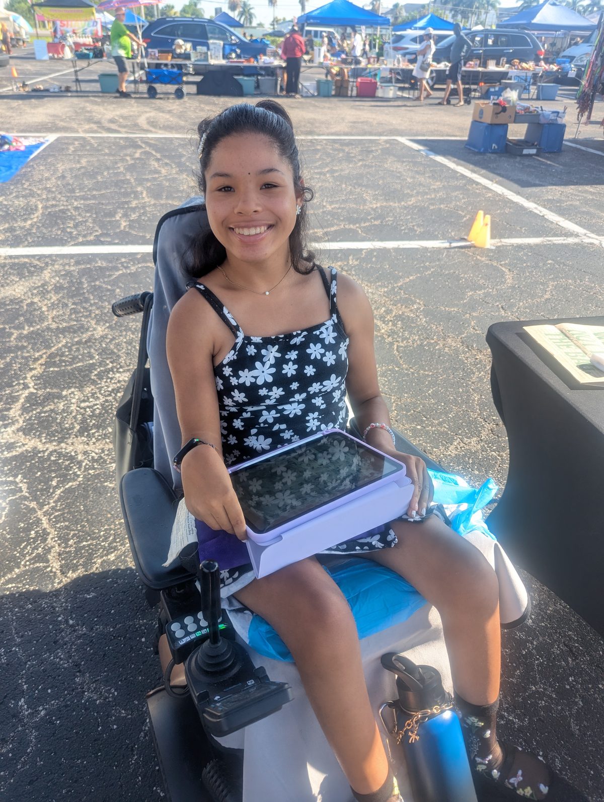 Mari, a member of the Shared Grounds and Sons community, at a farmers market